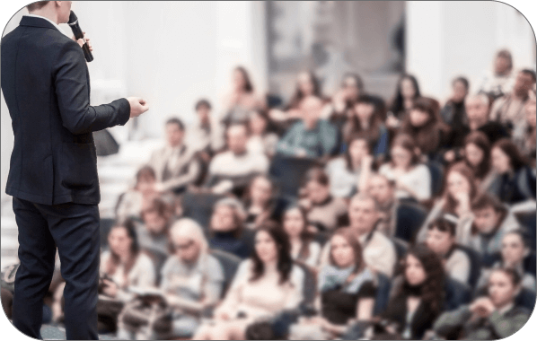 Person speaking to a crowd